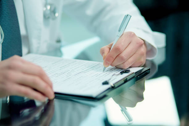 close-up. doctor making notes on the clipboard . Consult. ENT Surgery